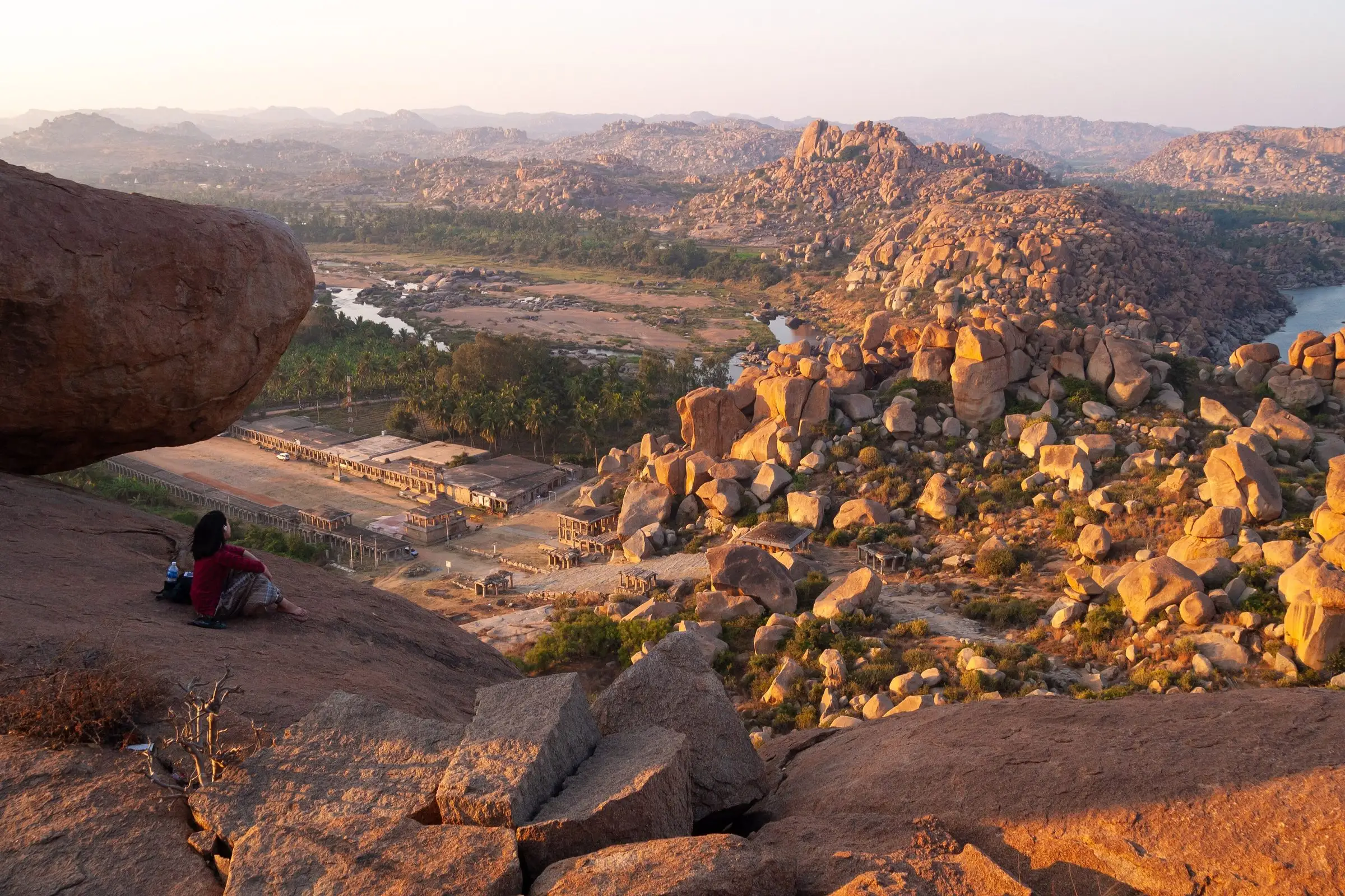 Golden evening light over the boulder hills and ruins of Hampi
