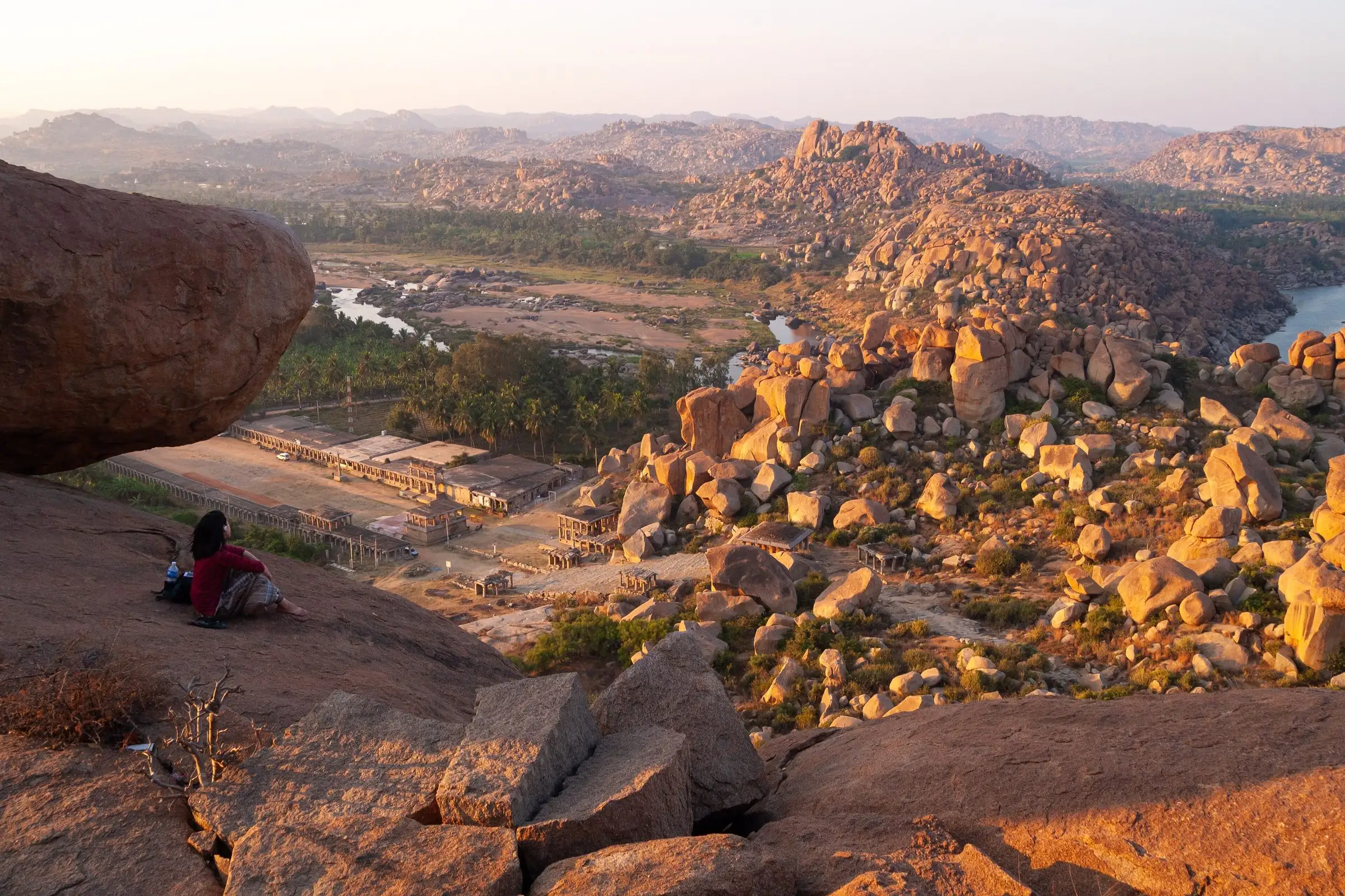 Golden evening light over the boulder hills and ruins of Hampi