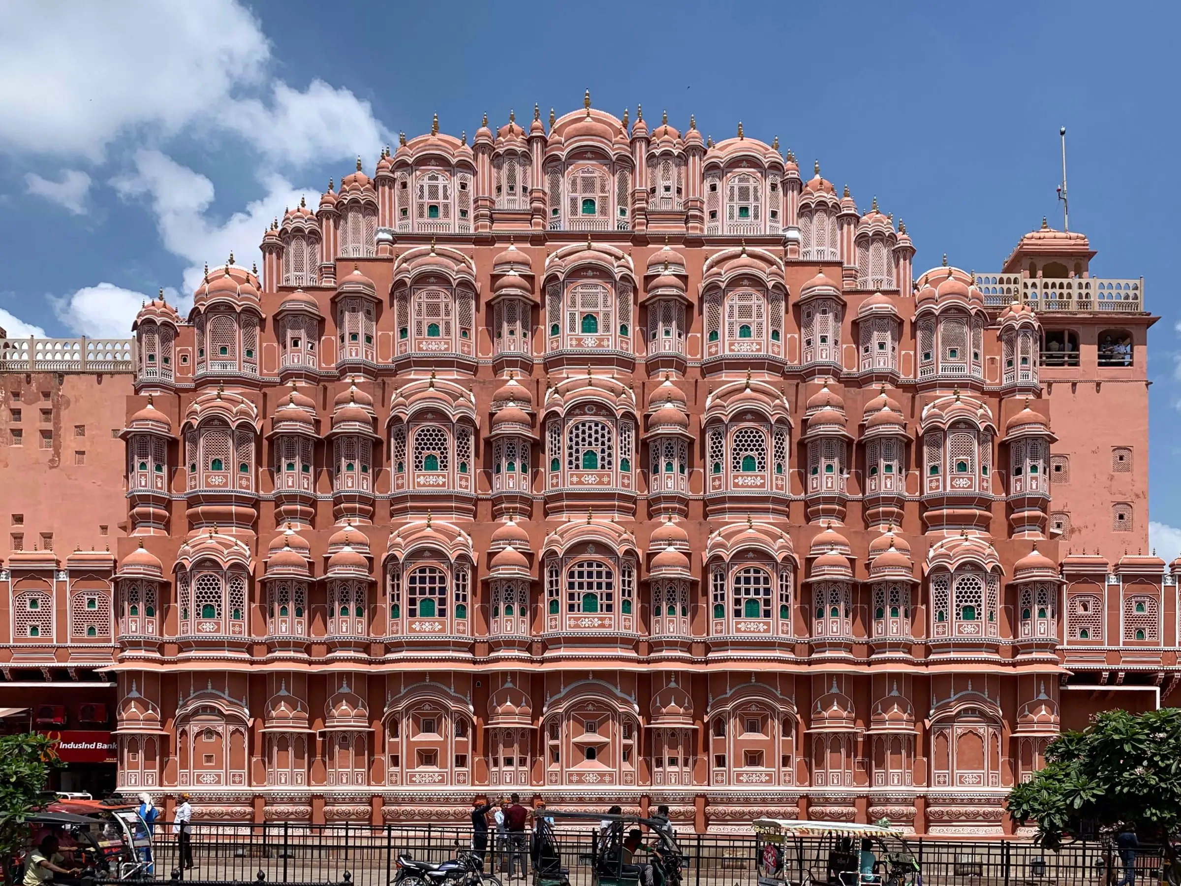 The pink sandstone facade of Hawa Mahal in Jaipur with its many small windows