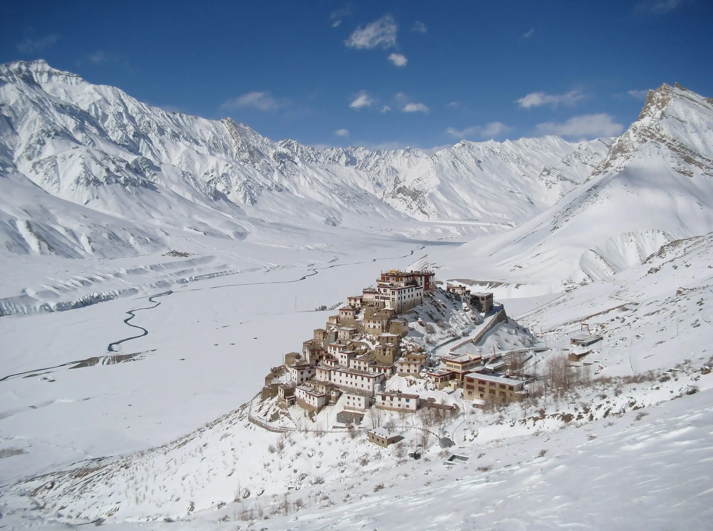 Key Monastery on a hill in a snow-covered valley in Spiti