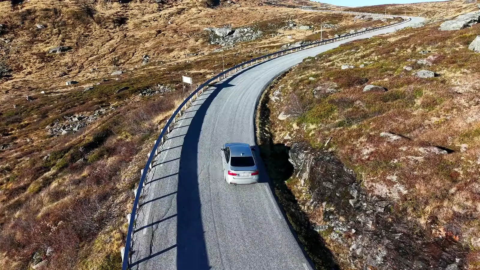 Aerial view of a car on a mountain road