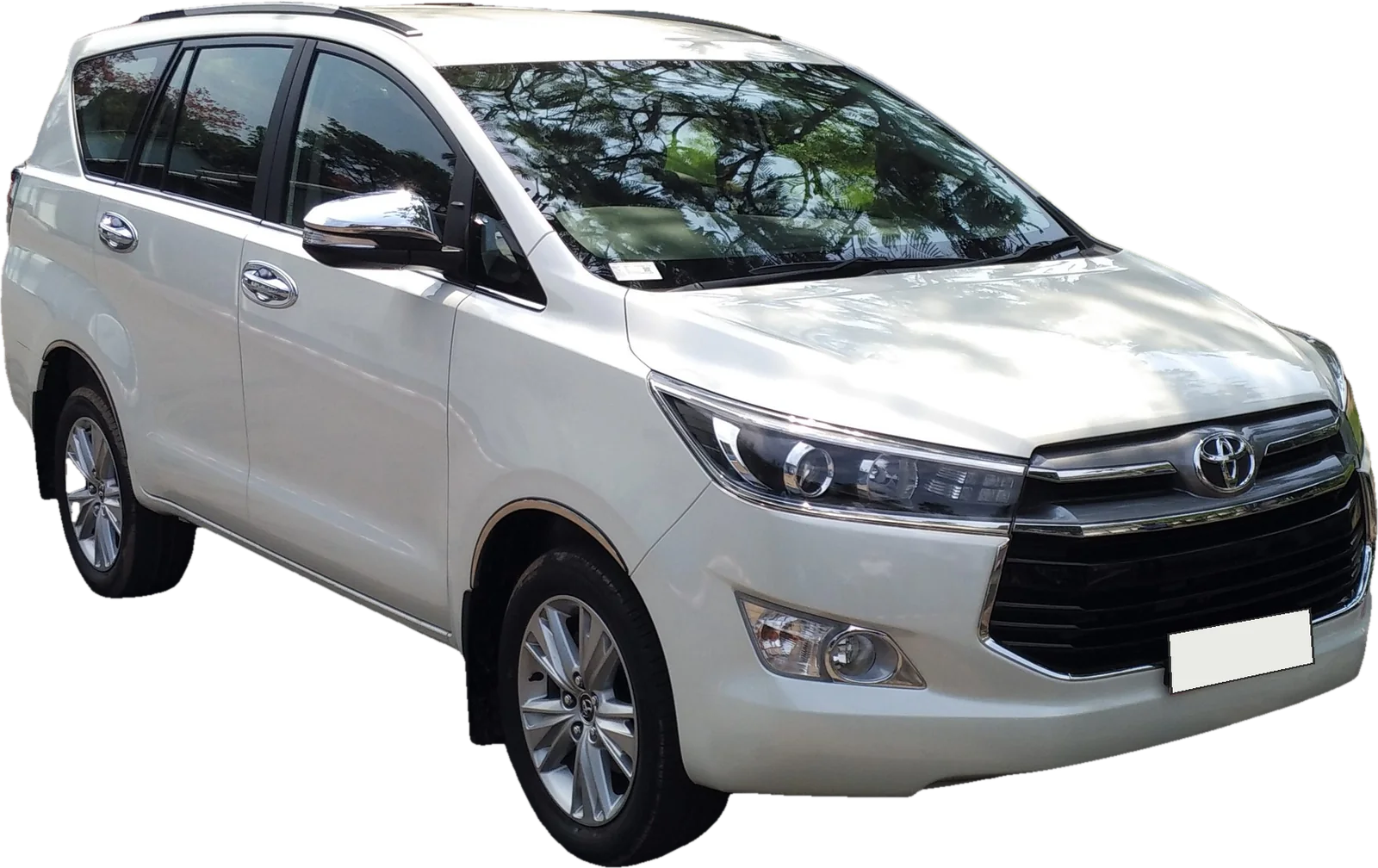 A white Toyota Innova Crysta, front three-quarter view
