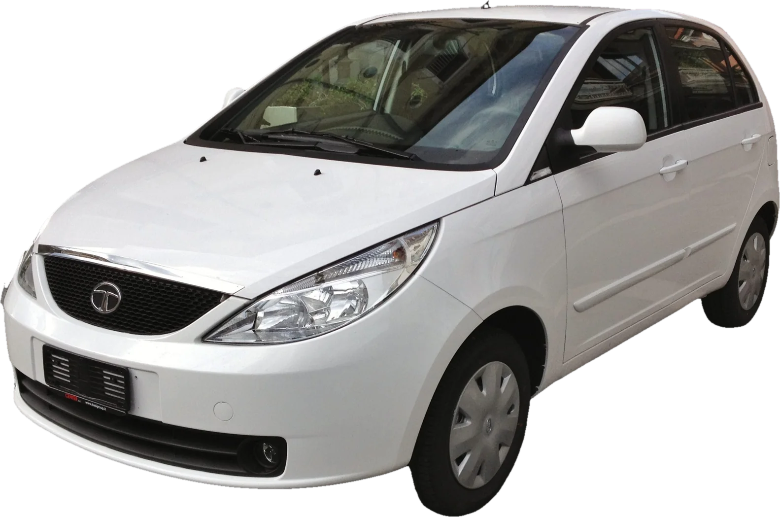 A white Tata Indica Vista hatchback, front three-quarter view